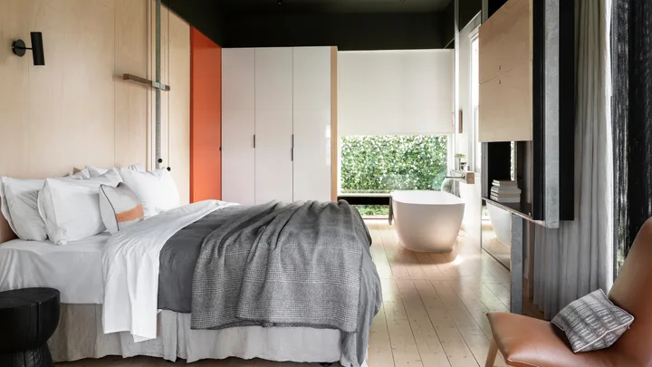The cool grey and white tones of Suite Five at Drift House, Port Fairy.