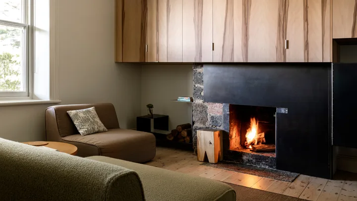 The cosy fire in the living area at Suite One, Drift House, Port Fairy.