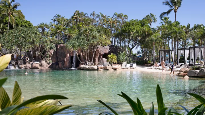 The lagoon pool surrounded by lush gardens at JW Marriott Resort & Spa.