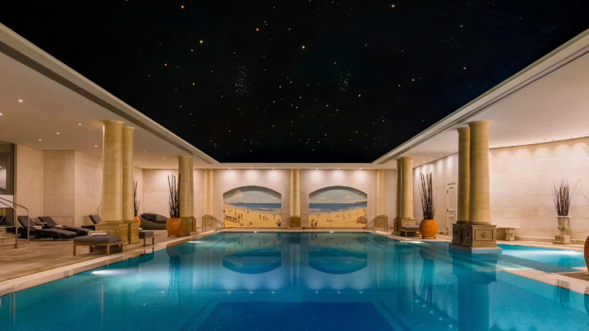 The deep blue indoor pool is mirrored by a starry ceiling, a nod to the nearby Observatory, at the Langham Sydney.