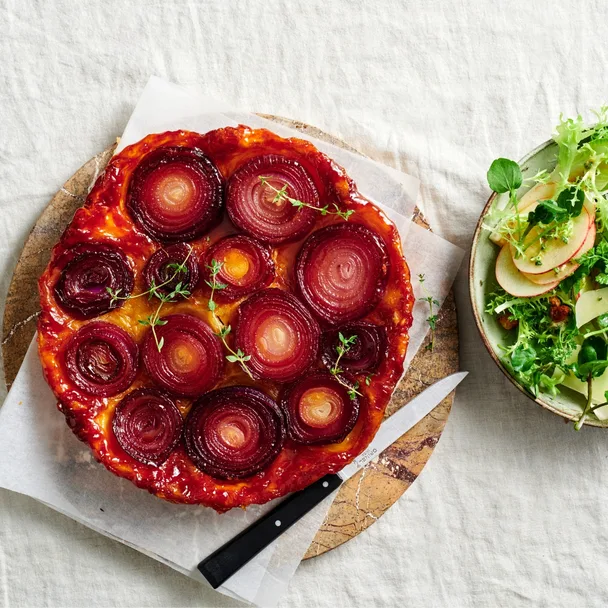 Roast onion tarte Tatin with apple and Comté salad
