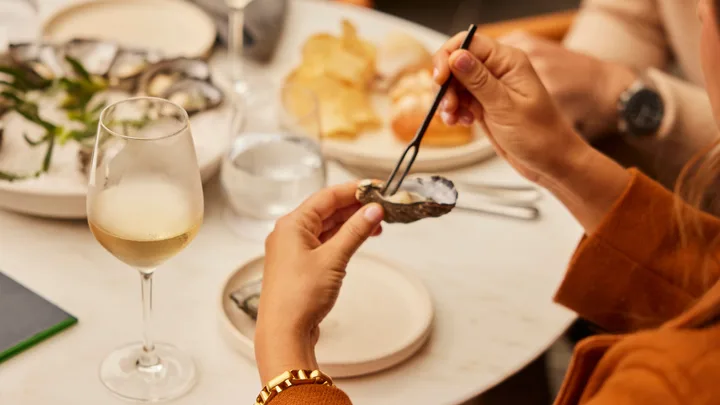 Oysters and white wine at the Deco Lounge at The Tasman Hotel.