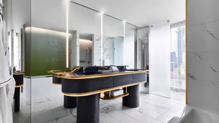 Marble flooring and floor to ceiling mirrors of the Marvelous bathroom suite at W Melbourne.