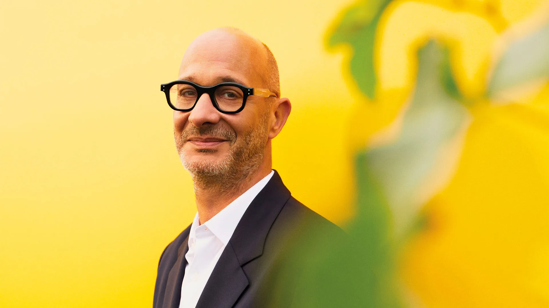 Portrait of Veuve Clicquot's cellar master Didier Mariotti with bright yellow background