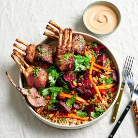 Spiced lamb racks with roast vegetables, couscous and harissa yoghurt