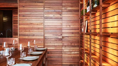 Warm timber dining room at Scholé restaurant in Hobart