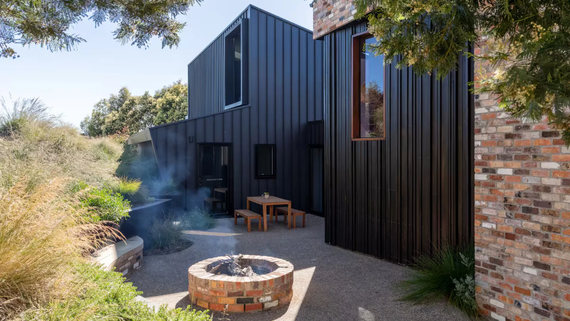 The outdoor fire and courtyard at Trevallyn Retreat, a luxe Launceston Airbnb.