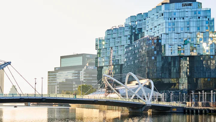 The shiny exterior of 1 Hotel Melbourne on the water at Docklands.