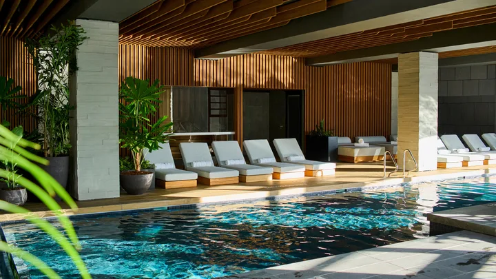 The stylish indoor swimming pool at 1 Hotel Melbourne.