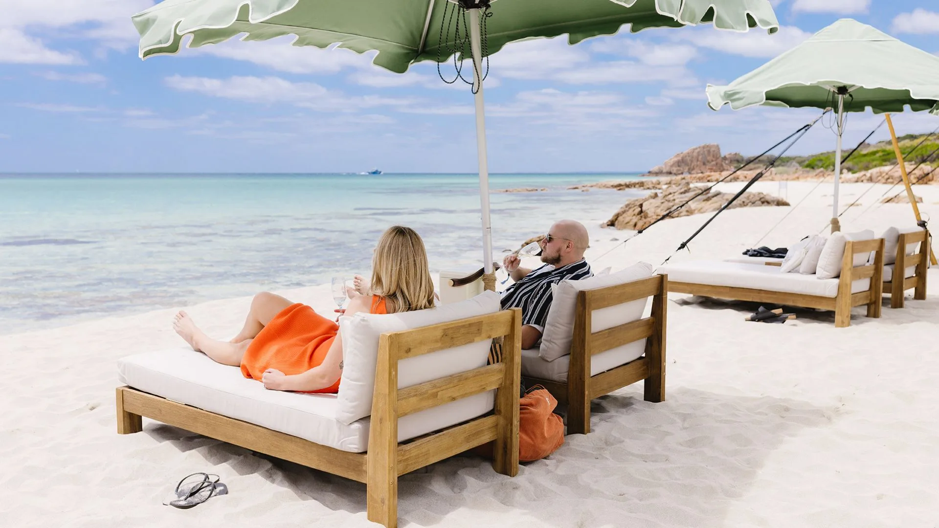 a couple on day beds at Pair'd Margaret River Region beach club
