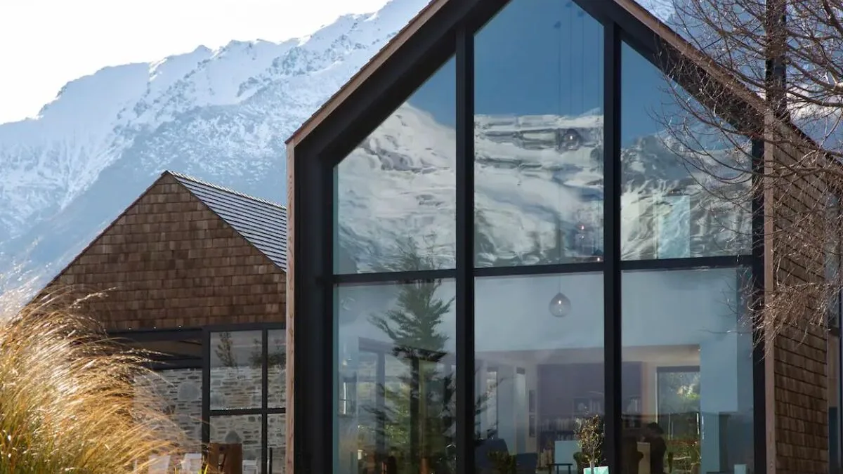 Shingled wood and glass exterior at Shinglehouse Queenstown Airbnb