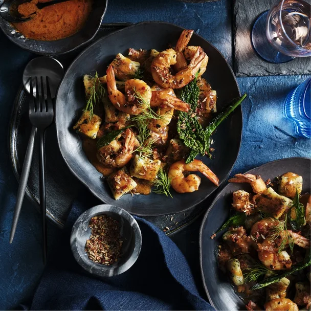 Fried cavolo nero gnocchi with peppered prawns and pancetta