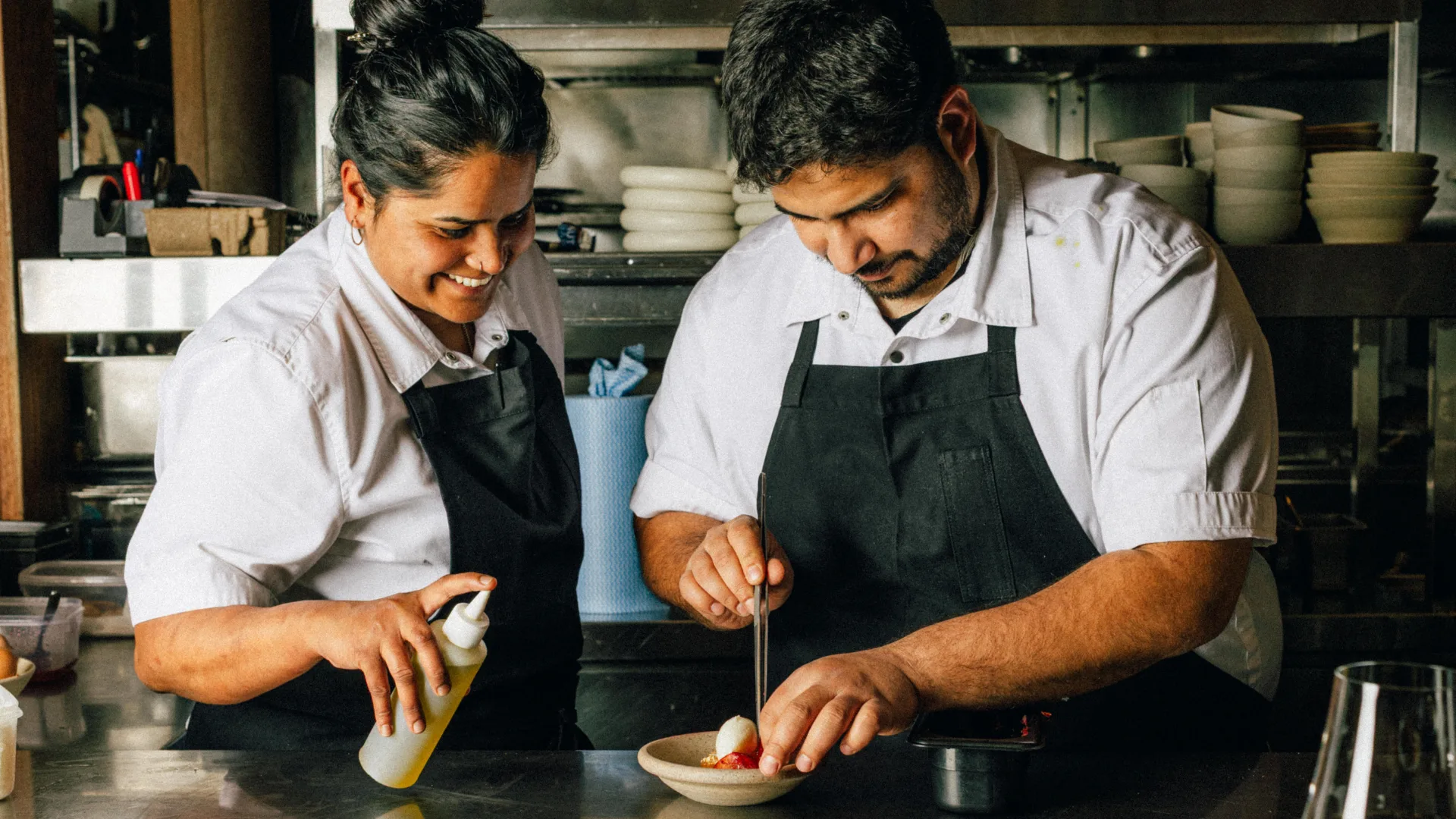 Chefs Saavni Krishnan and Sriram Aditya Suresh in the kitchen at Saadi in Melbourne