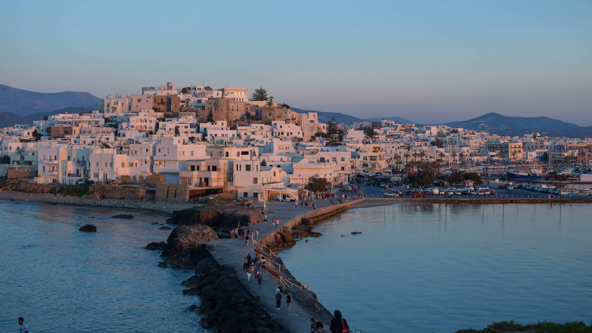 High angle view of townscape by sea against clear sky, Naxos and Lesser Cyclades, Greece.