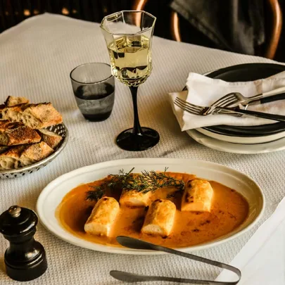 France-Soir’s Quenelles de Perche sauce Crevette: Baked sea perch dumplings in bisque