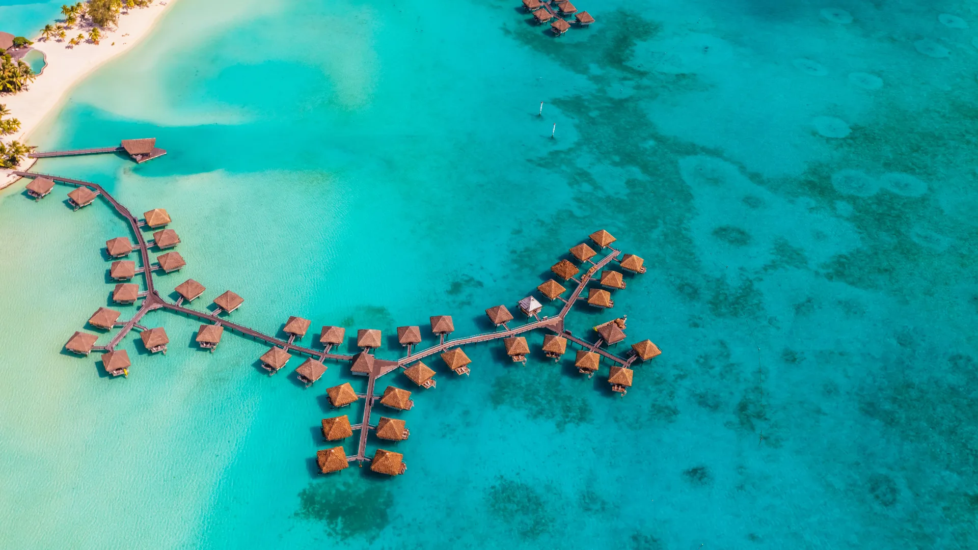 Aerial resort view of Bora Bora luxury Overwater bungalows French Polynesia an Atoll in the Pacific Ocean