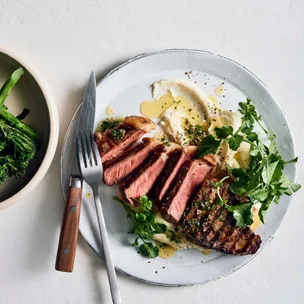 Char-grilled sirloin steaks with anchovy butter and swede purée