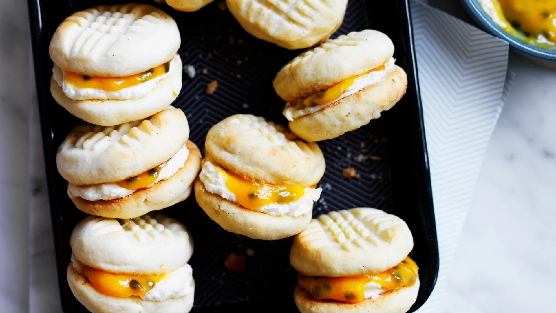 Lemon and vanilla melting moments with passionfruit curd.