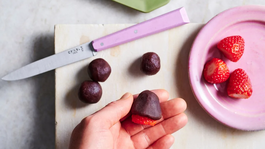 Red bean paste enclosing strawberries for mochi