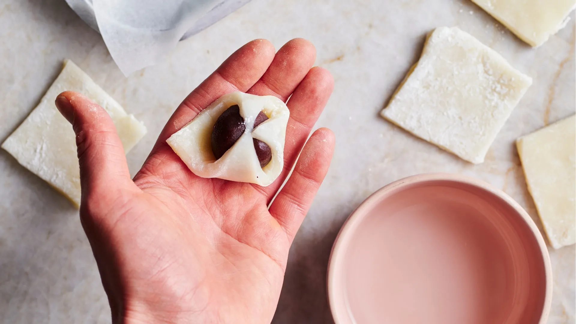 Mochi filling wrapped and sealed within dough.