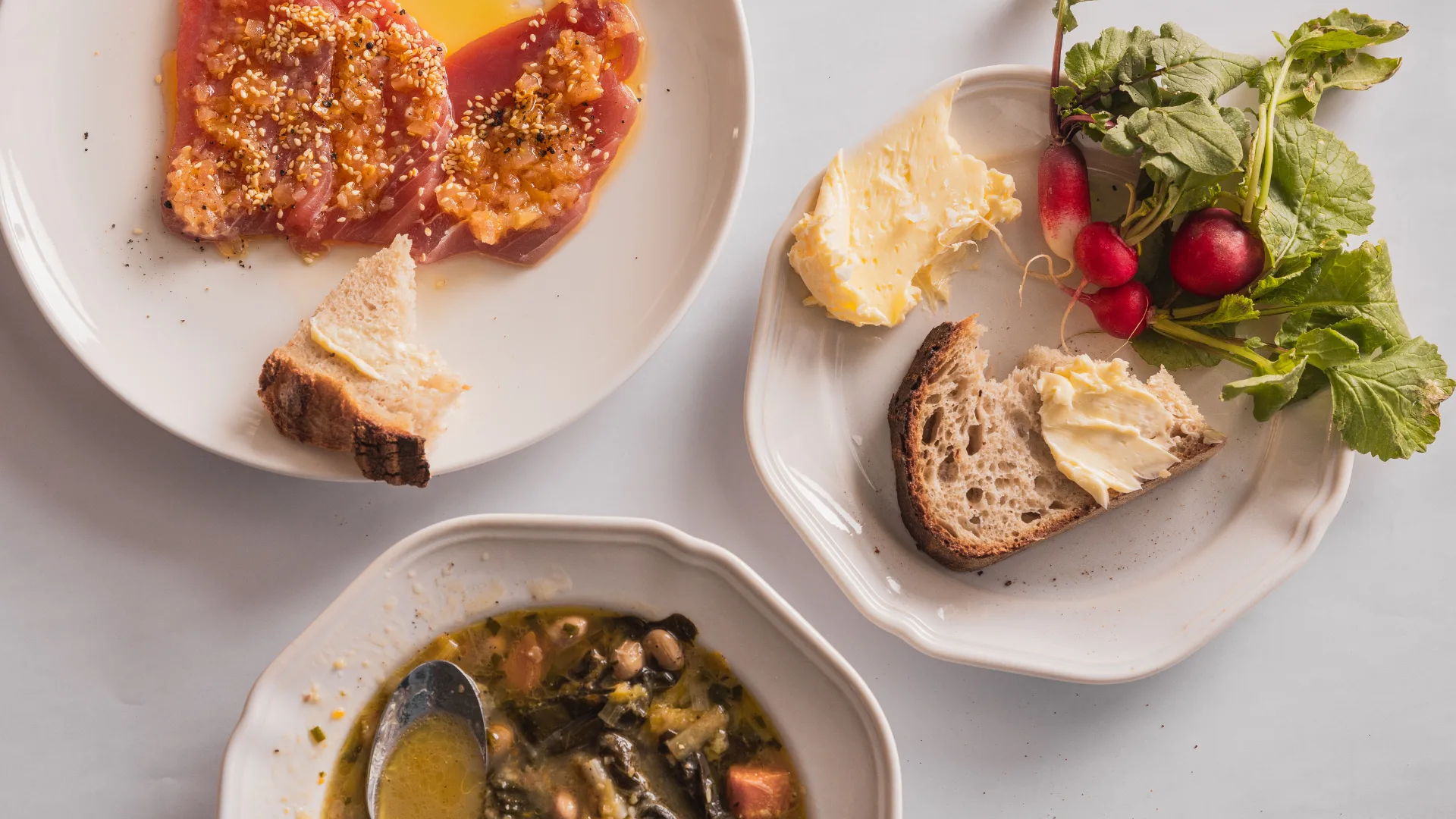 A tuna crudo, radishes and butter, and minestrone at Sydney restaurant The Corner in Palm Beach