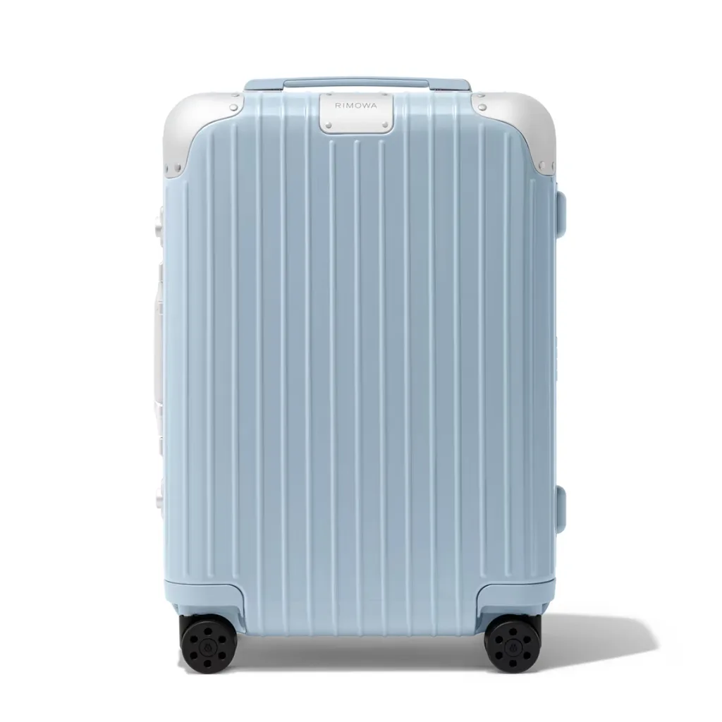 Rimowa hybrid cabin luggage in gloss sky blue, featuring lightweight polycarbonate shell and anodised aluminium corners and framing.