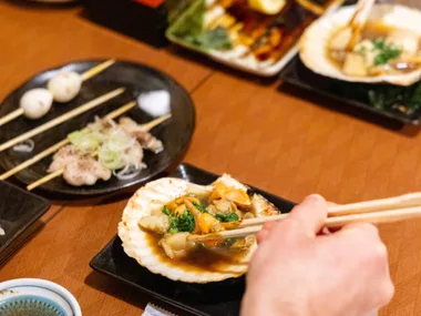 Dive into Shinjuku's vibrant and chaotic atmosphere with traditional Japanese dishes during this tour