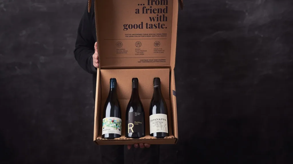 Wine bottles in a cardboard box, delivered as part of the Wine Collective's monthly subscription service