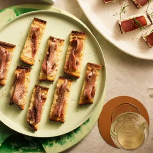 Anchovies and roast garlic on toast