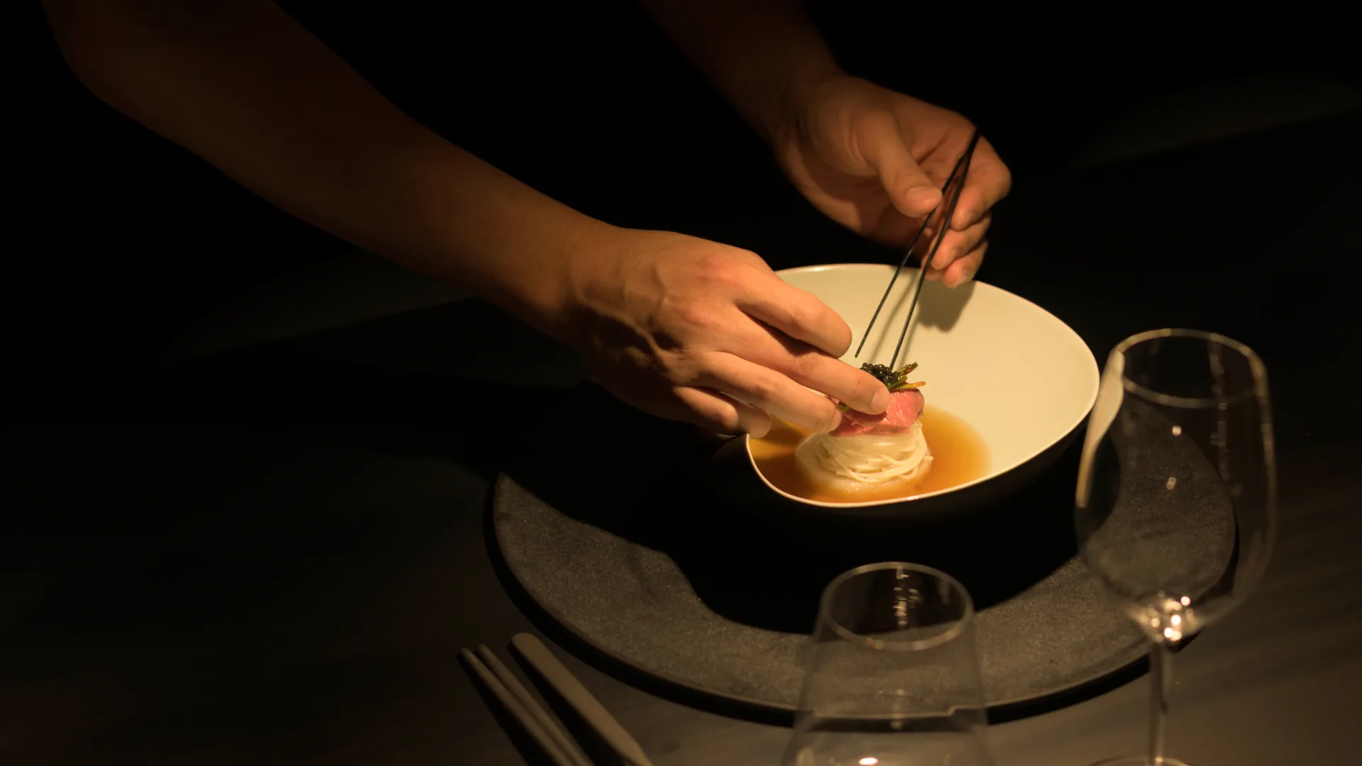 Chef Andy Choi delicately plating a noodle dish at exciting new Brisbane Korean restaurant Suum