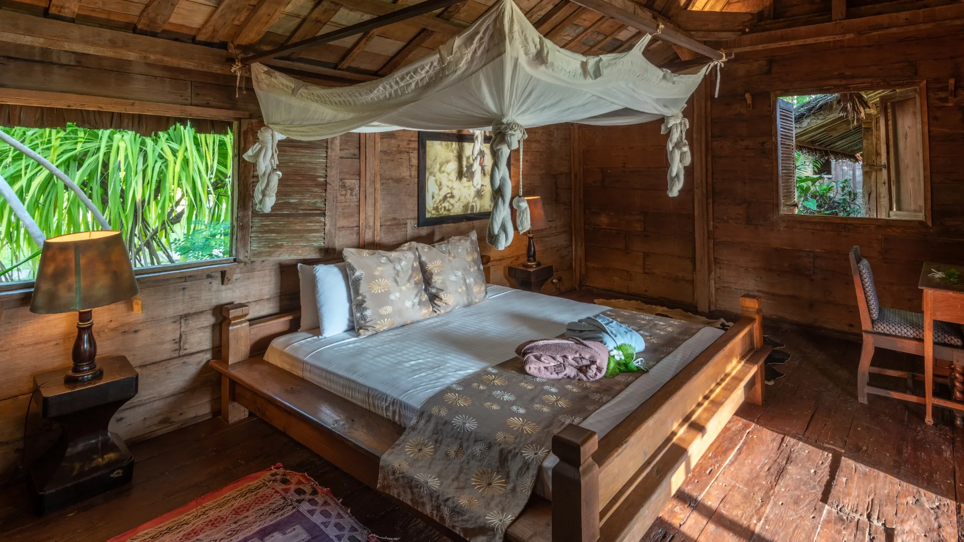 Interior of Javanese teakwood villa at Ratua Private Island
