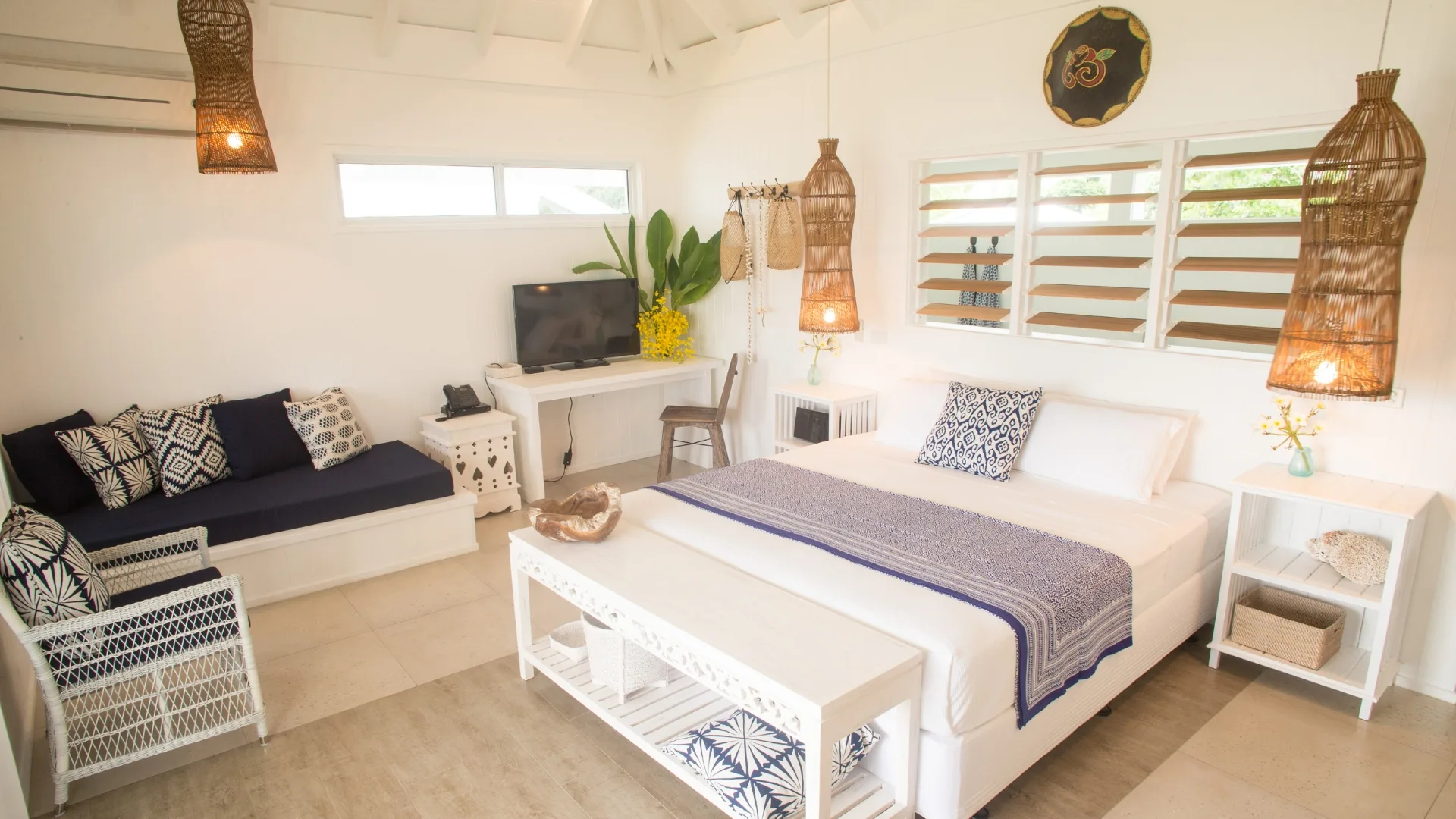 Beachfront villa bedroom at Tamanu on the Beach resort