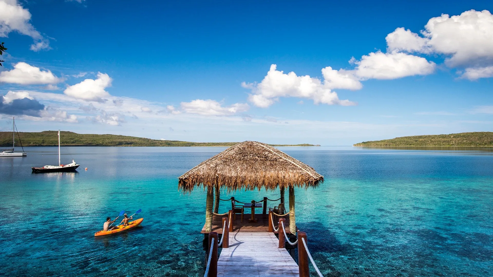 Jetty out into crystal-blue water at The Havannah Vanuatu luxury resort