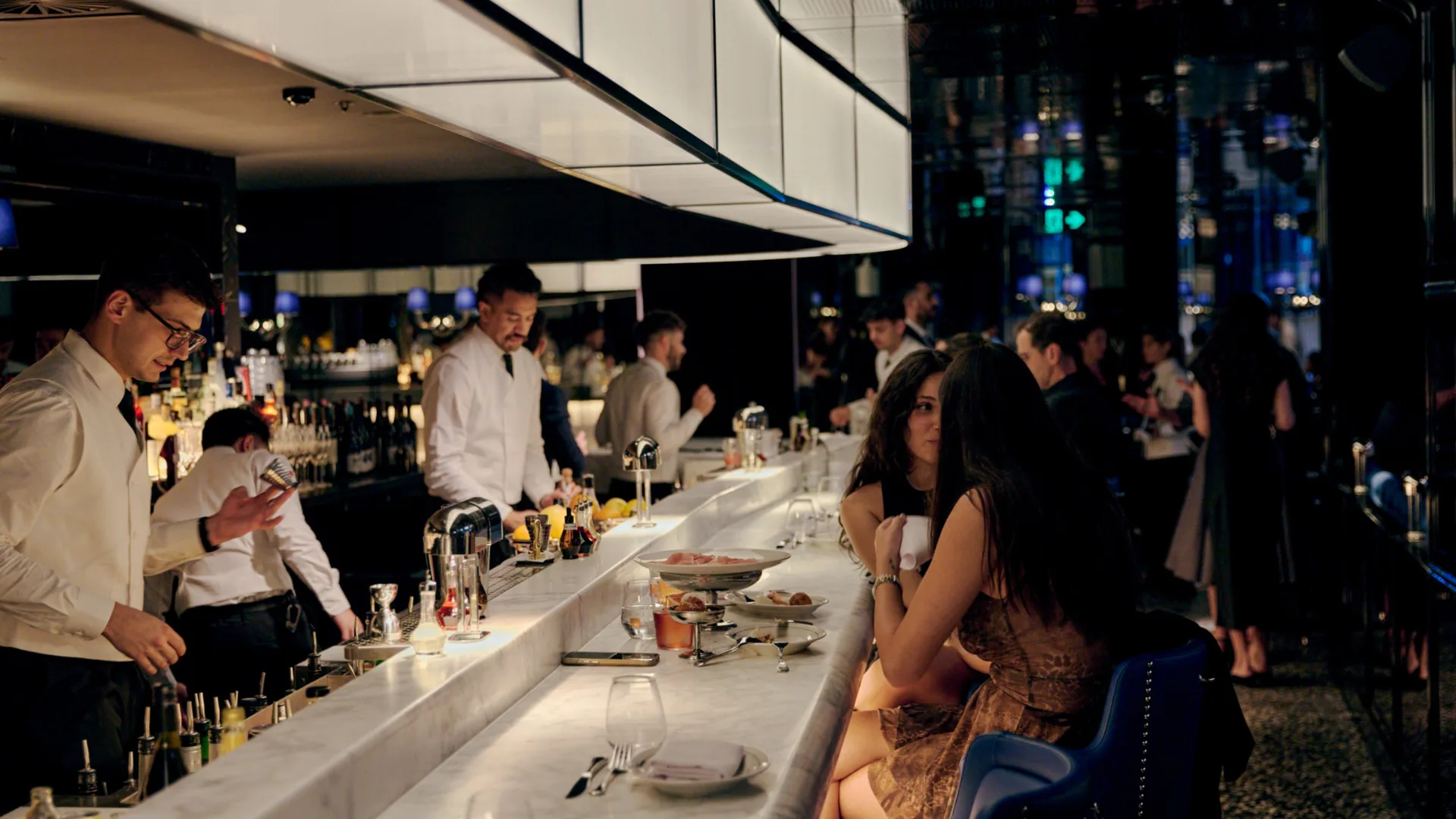 Diners at the marble bar in Grill Americano Sydney