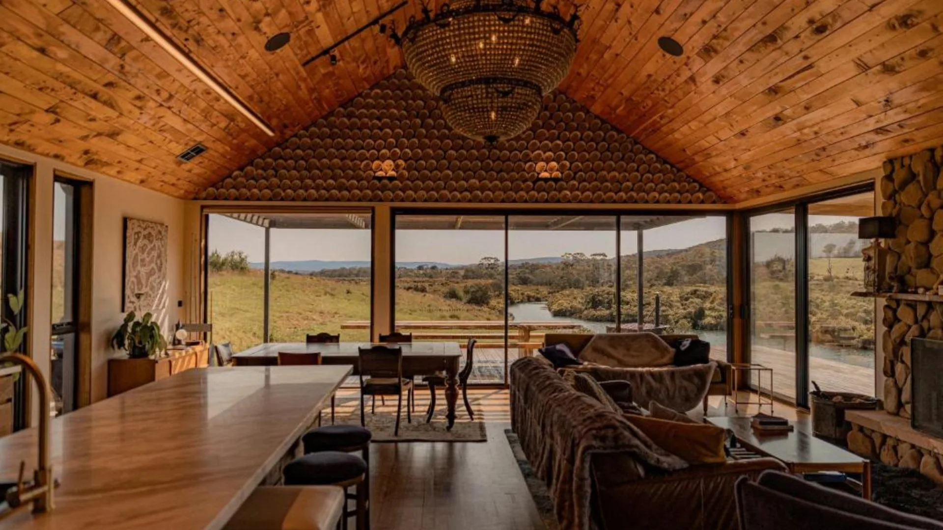 Warm timbers, floor-to-ceiling windows and a fireplace make for the ideal setting to take in the Swan River at Swan River Sanctuary in Swansea