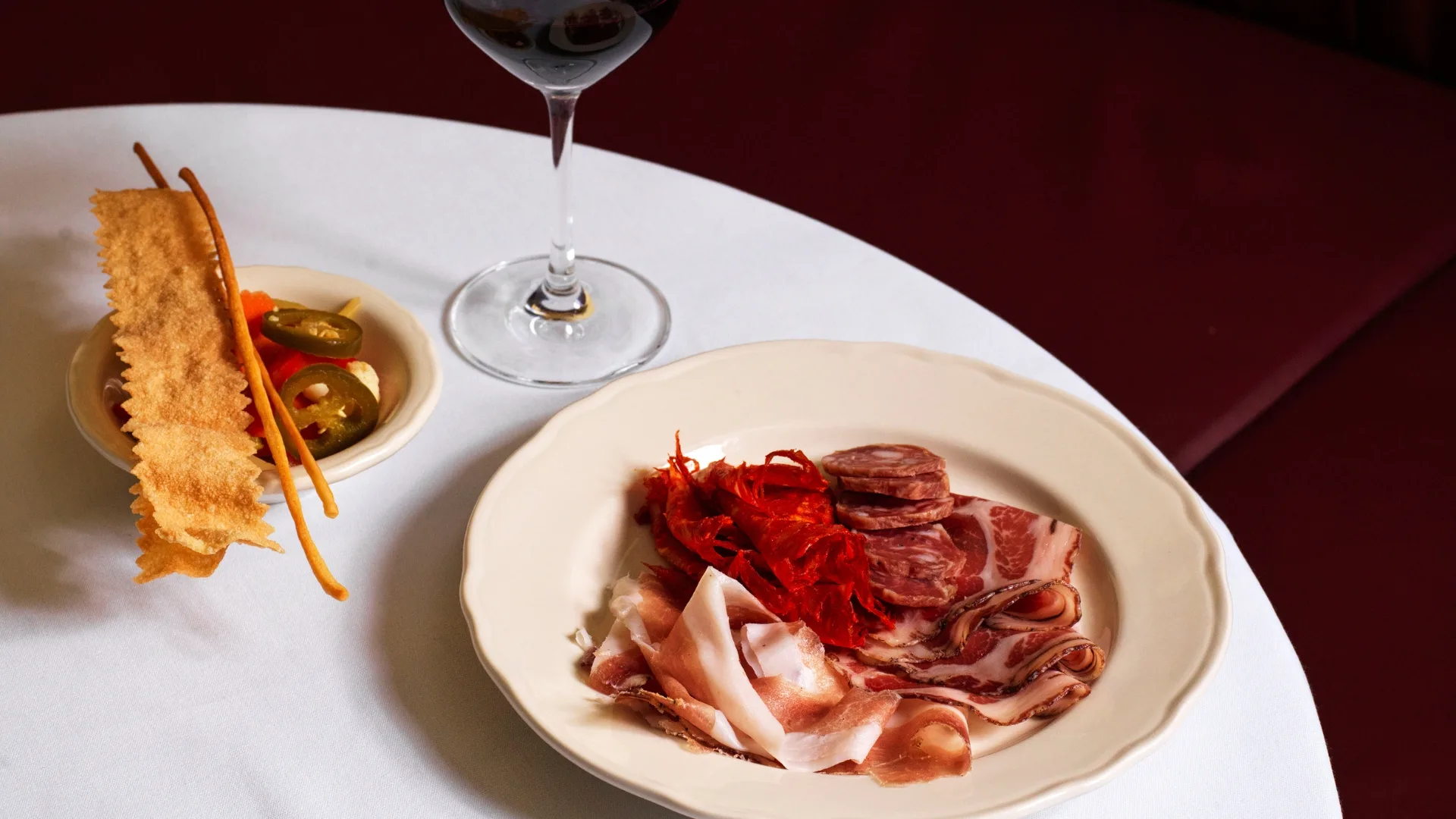 A plate of Vin-cenzo's salumi misti: salumi, giardiniera, grissini 