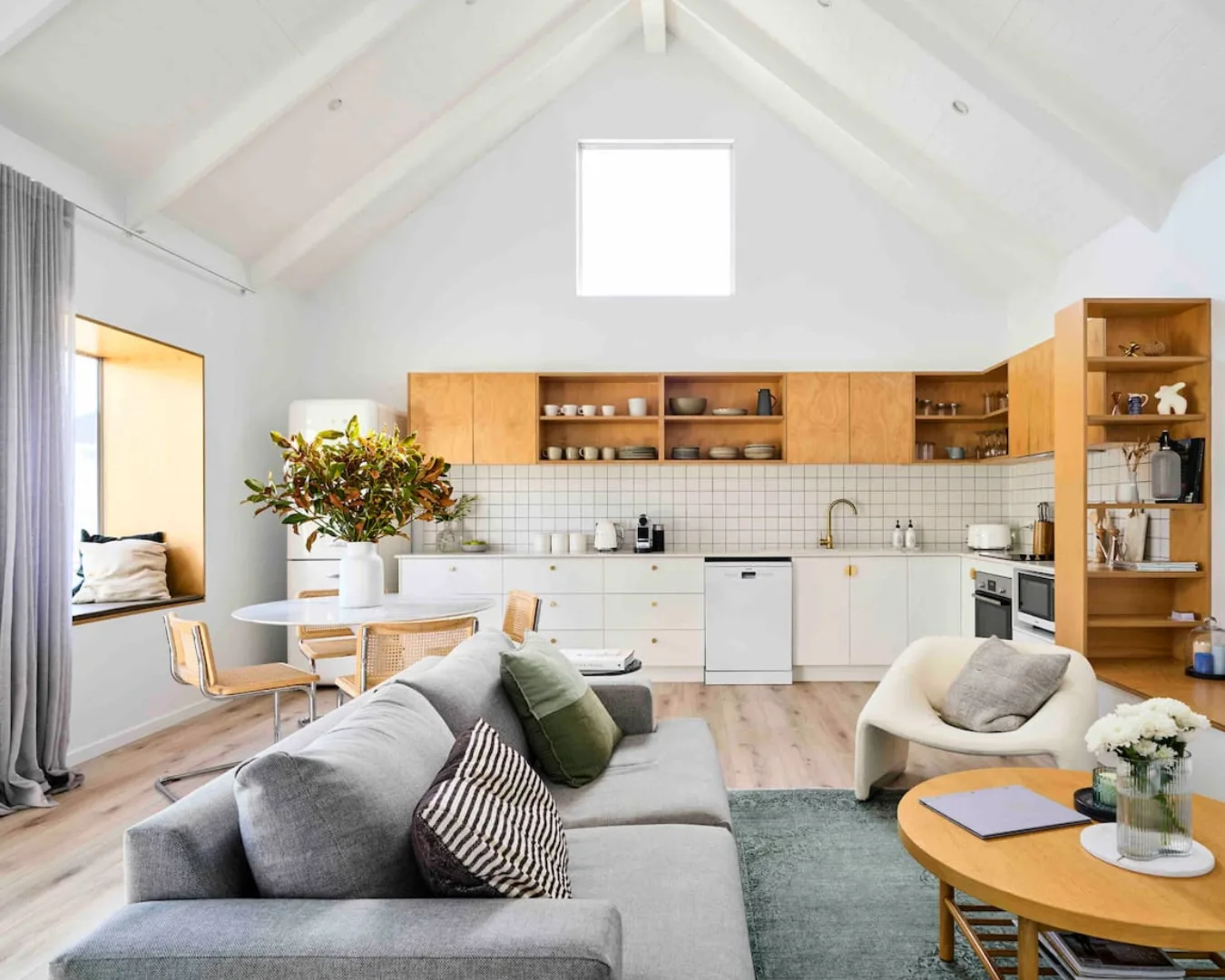A modern, Scandinavian-inspired kitchen and living area