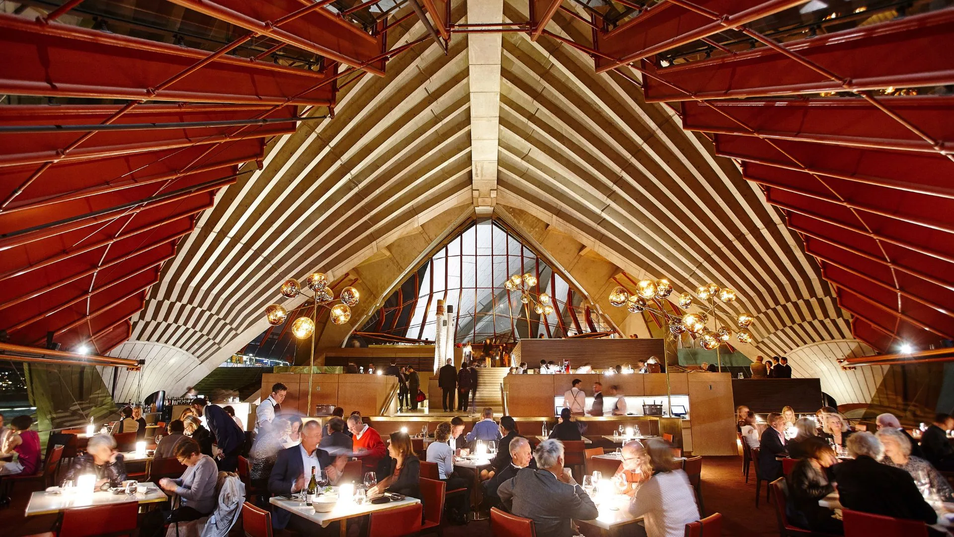 the iconic arched timber interiors of Bennelong restaurant in the opera house on New year's eve in sydney