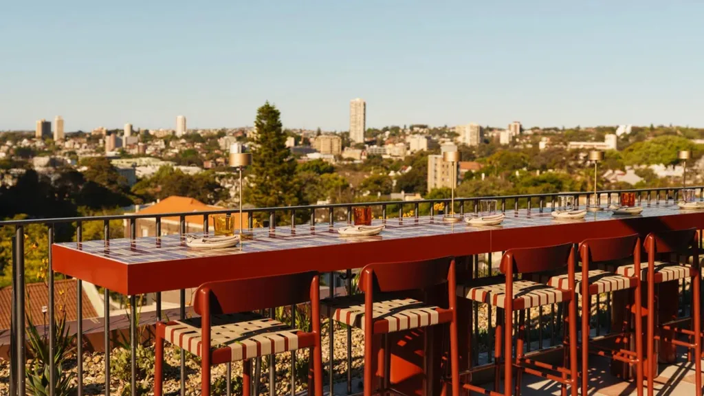 where to have dinner on new year's eve in sydney 2025 rooftop bar in paddington with red tables and view over sydney