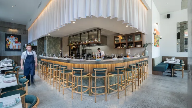 Bar seating and dining room at Clarence