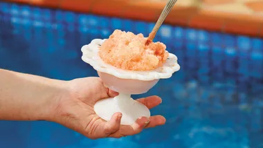a bowl of granita by a swimming pool