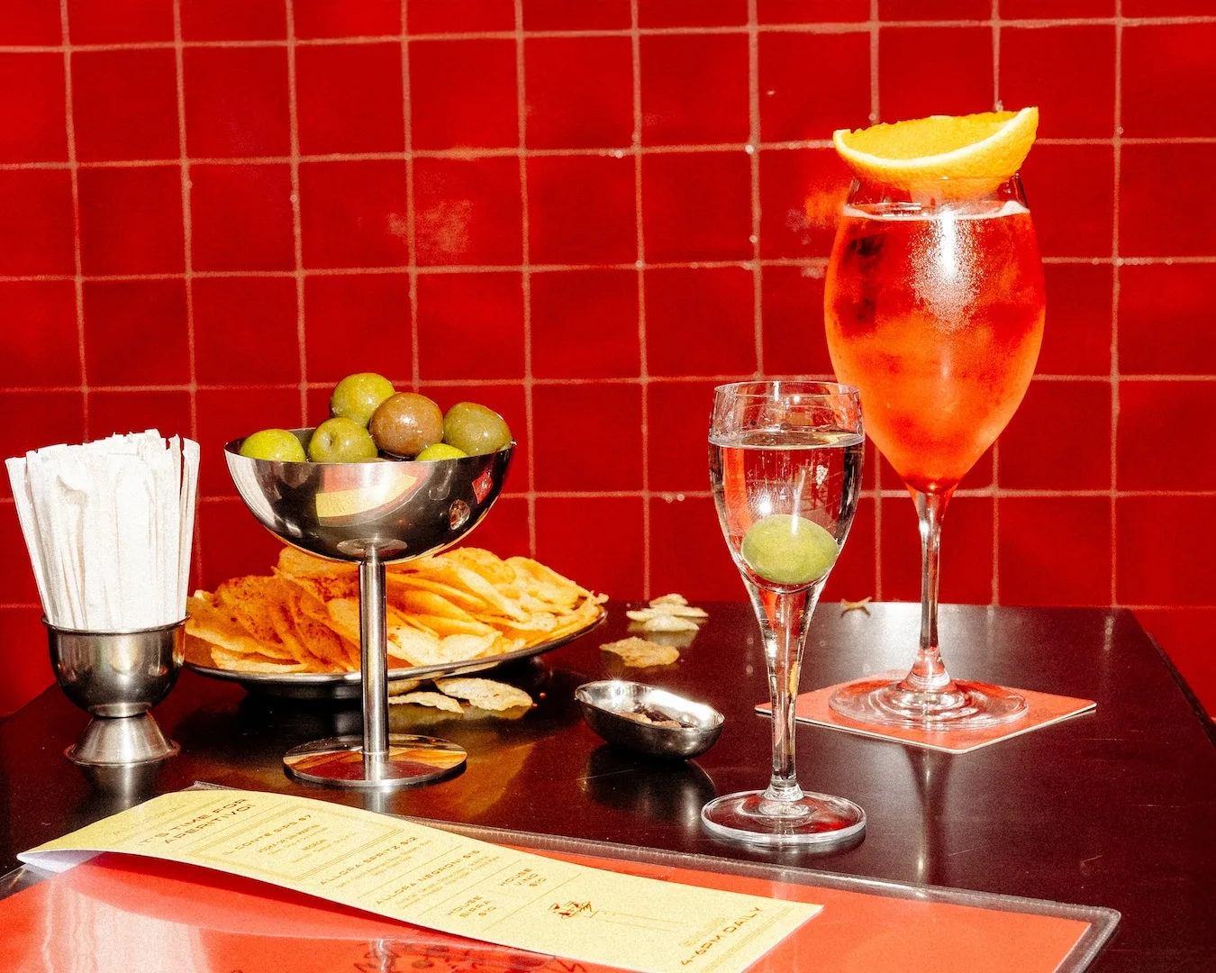 A sekection of drinks including an Aperol spritz and mini martini