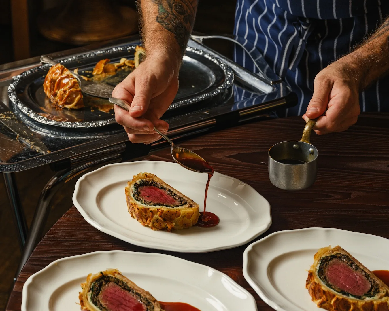 A sauce is served alongside a classic beef Wellington at new Sydney restaurant The James