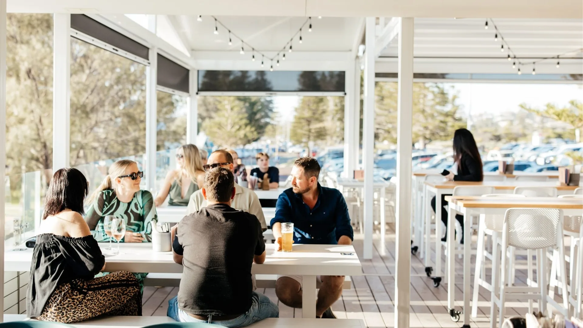 A sun-drenched outdoor dining area at Bert's in City Beach, Perth