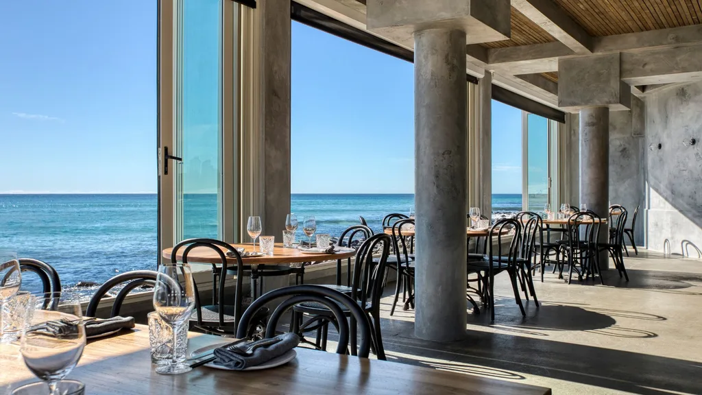 The dining room and floor to ceiling windows with ocean views from Rick Shores restaurant on the Gold Coast