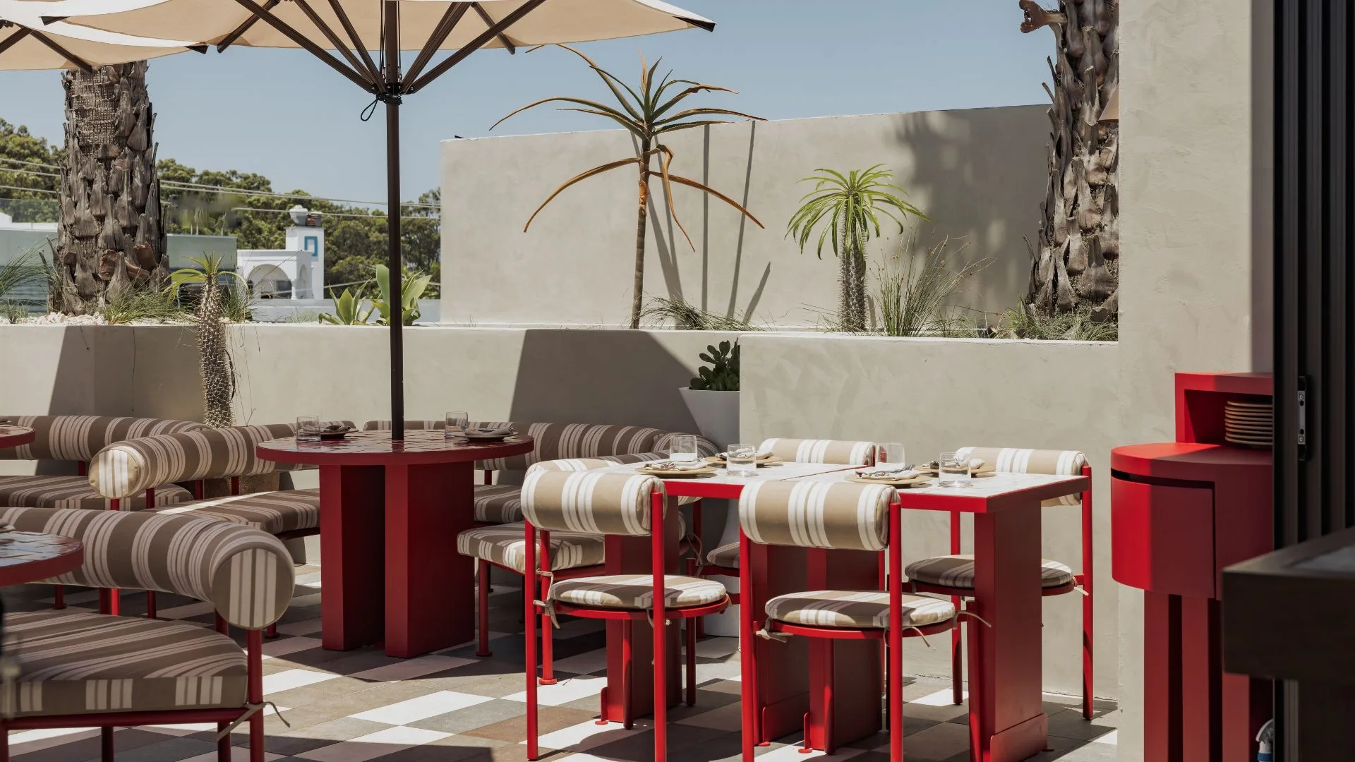 red chairs with striped covers on the rooftop of Sueno restaurant on the Gold Coast