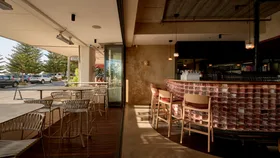 The interior of Perth restaurant Brighton Wine Bar looking out to the ocean