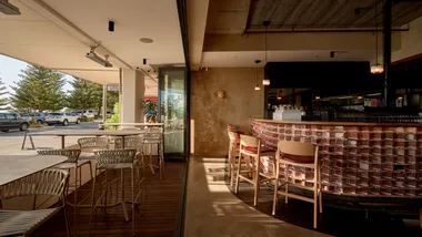 The interior of Perth restaurant Brighton Wine Bar looking out to the ocean