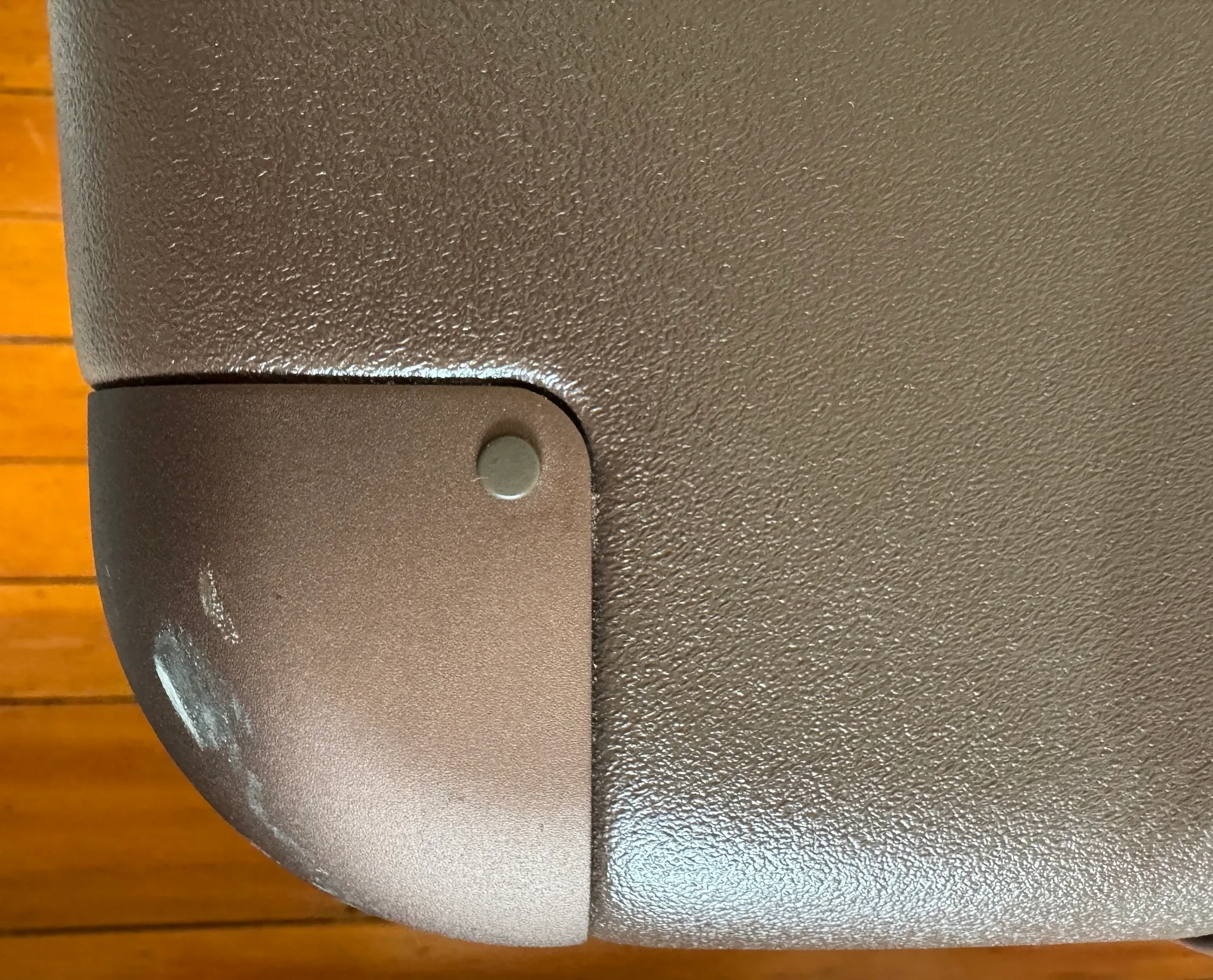 July suitcase with wear showing on the bumper