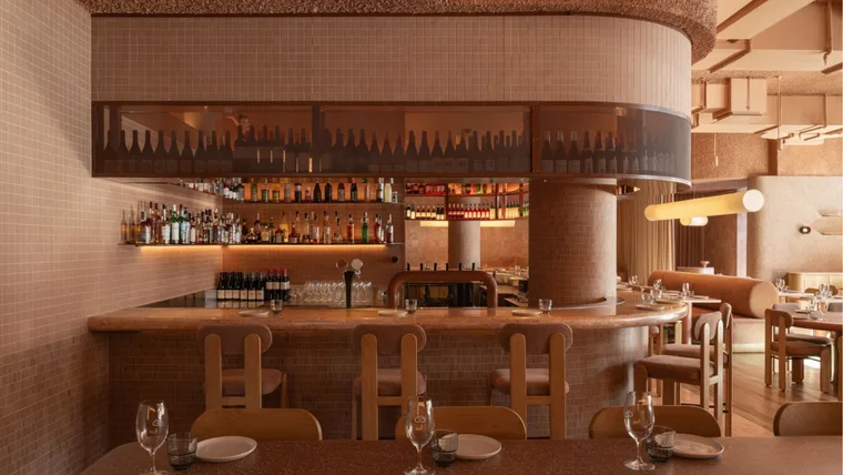 The terracotta-hued, textured dining room at Light Years, Perth